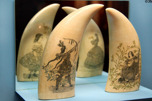 Scrimshaw (c1850-75) native with bow & arrow plus female figures on whale teeth at Heritage Plantation. Sandwich, MA.