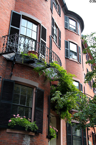 Curved brick fronts & iron balconies on Chestnut St. in Beacon Hill. Boston, MA.