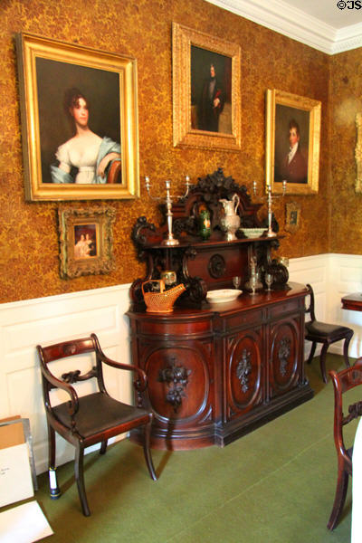 Sideboard in dining room with Appleton family portraits (2 by Gilbert Stuart) at Longfellow National Historic Site. Cambridge, MA.