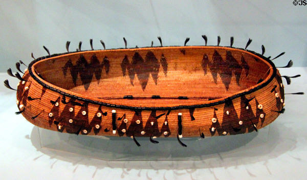 Pomo elliptical basket with quail plumes & beads (c1920) at Peabody Museum. Cambridge, MA.