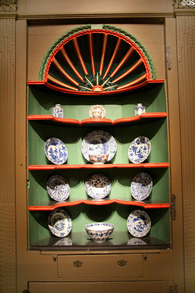 Corner cupboard (c1749) with collection of pottery & porcelain of the time at Museum of Fine Arts. Boston, MA.