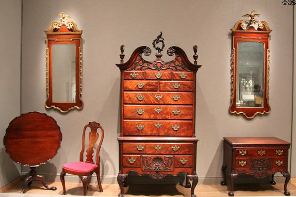 High chest of drawers (c1760-70) from Philadelphia plus early looking glasses, chairs & tilt-top table from Pennsylvania at Museum of Fine Arts. Boston, MA.