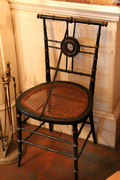 Caned side chair in music room at Gibson House Museum. Boston, MA.