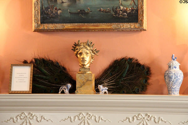 Sculpted head with peacock feathers on parlor mantle at Nichols House Museum. Boston, MA.