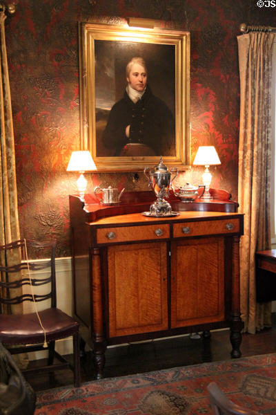 Portrait of Mr. Lee of Liverpool (1890s or prior) over American Empire maple sideboard (1830s) in dining room at Nichols House Museum. Boston, MA.