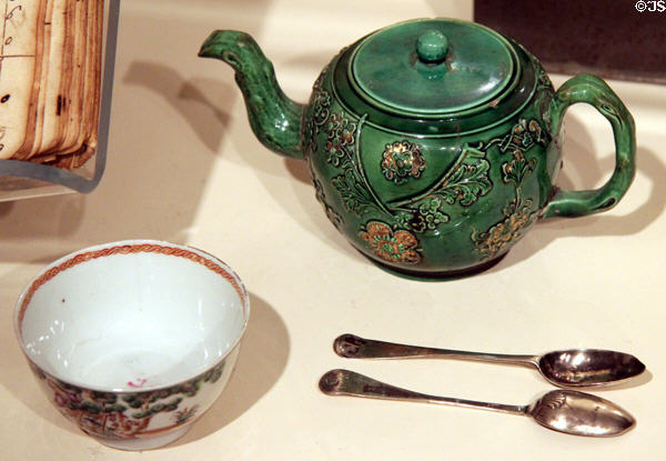 Staffordshire glazed earthenware teapot (1750-60) & Chinese porcelain tea bowl (1750-70) with teaspoons (c1760) by Nathaniel Bartlett of Concord at Concord Museum. Concord, MA.