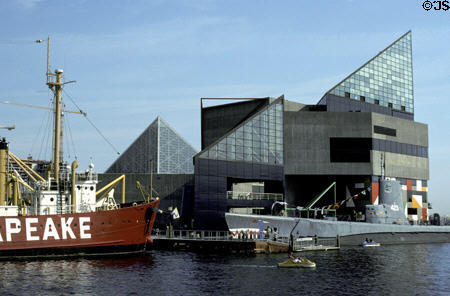 Ships of Baltimore Maritime Museum along side National Aquarium. Baltimore, MD.
