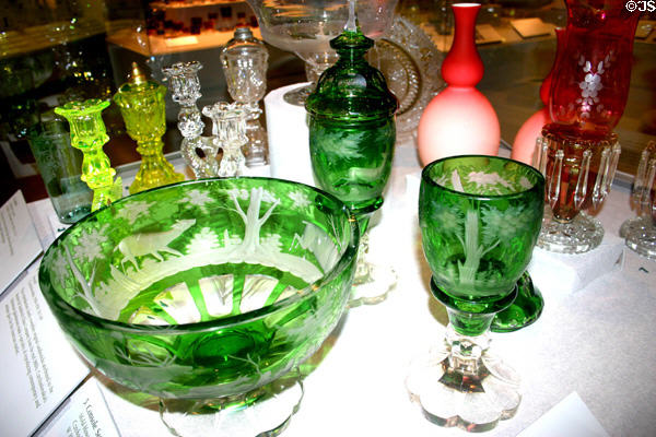 Green engraved Console set of bowl & covered glasses (1918-38) made in Czechoslovakia copying antique Bohemian design in Maine State Museum. Augusta, ME.