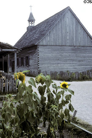 St Anne church with sunflowers at Colonial Michilimackinac. Mackinaw City, MI.