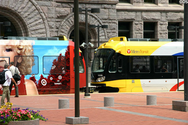 Multicolored Metro Transit streetcars in front of City Hall. Minneapolis, MN.