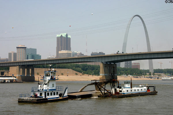 Dredging operation on Mississippi River against Poplar Street Bridge (aka Bernard F. Dickmann or Interstate Highway Bridge)( 1967) (197m / 647ft). St Louis, MO.