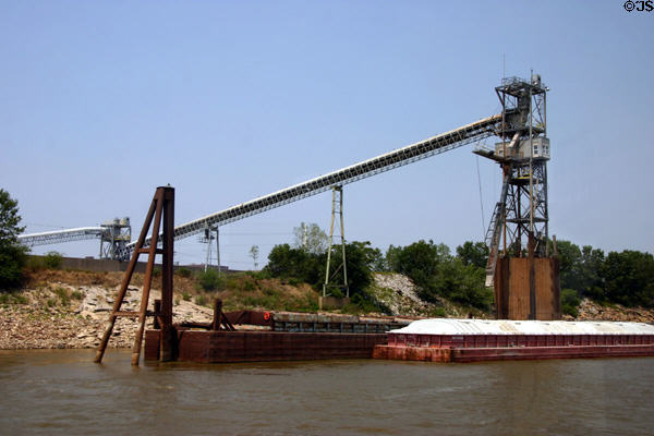 Mississippi River barge with conveyor belts beyond. St Louis, MO.