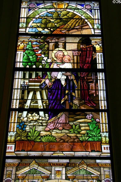 Stained glass window (1912) of Joseph holding Jesus at Kansas City Cathedral. Kansas City, MO.