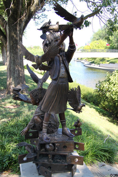 New Friends bronze statue (1997) near Brush Creek at Country Club Plaza shopping area. Kansas City, MO.