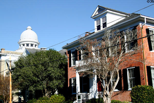 Federal style house (509 S. Wall St.) against dome of Temple B'nai Israel. Natchez, MS.