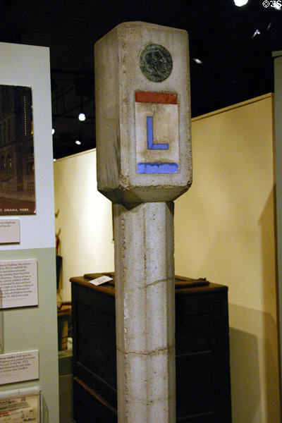 Lincoln Highway Marker (1920s) of first coast to coast automobile road in Museum of Nebraska History. Lincoln, NE.
