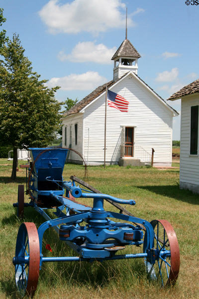 Antique farm machinery & Lutheran Church at Lincoln County Historical Museum. North Platte, NE.