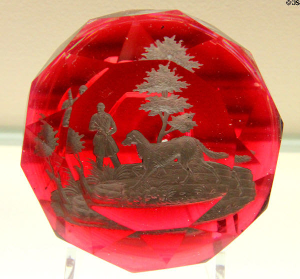 Glass paperweight with embedded hunter with dog (c1870-80) by Cristallerie de Pantin of France at Currier Museum of Art. Manchester, NH.