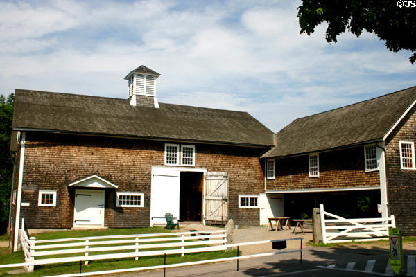 Shingle-sided horse barn (1819) of Canterbury Shaker Village. NH.