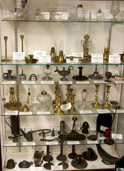 Collection of candlesticks & lamps at Woodman Museum. Dover, NH.