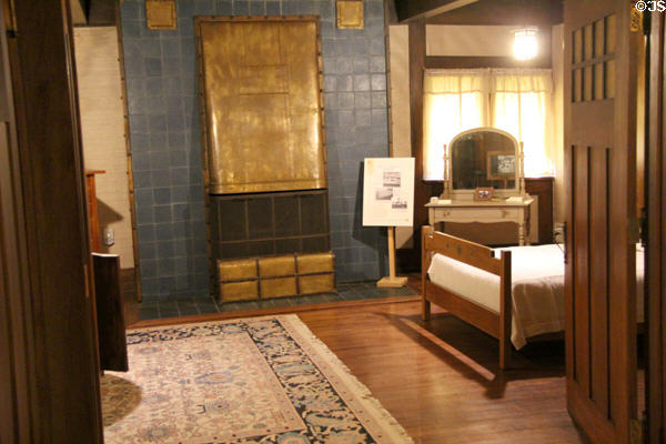 Bedroom with blue surround fireplace at Stickley Museum at Craftsman Farms. Morris Plains, NJ.