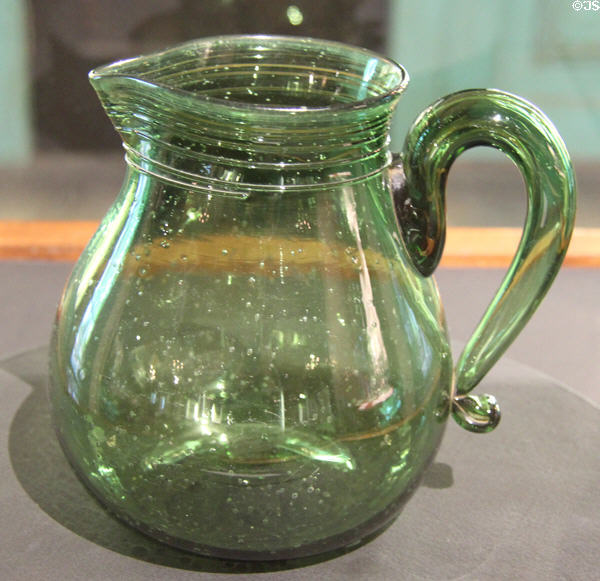 Green glass pitcher (1808-9) prob. by James Lee Glass Works of Millville or Port Elizabeth, NJ at Museum of American Glass. Milville, NJ.