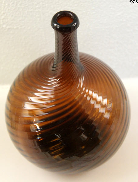 Glass Midwestern corn whiskey swirl flask (1815-30) by Zanesville Glass. of Zanesville, OH at Museum of American Glass. Milville, NJ.