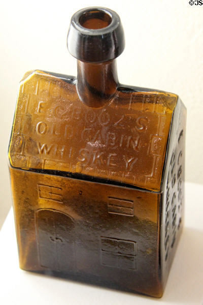 E.G. Booz Old Cabin Whiskey amber bottle (c1860) by Whitney Glass Works of Glassboro, NJ at Museum of American Glass. Milville, NJ.