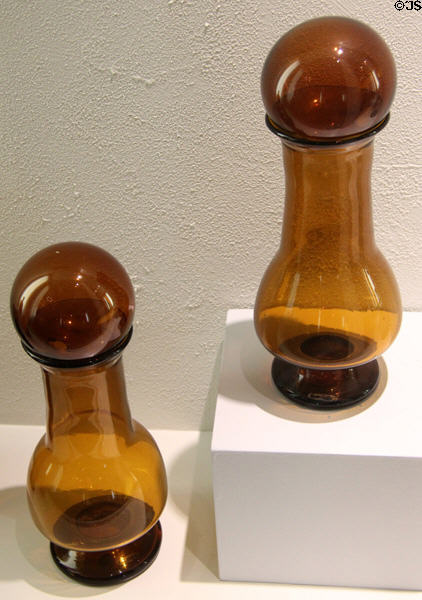 Pair of amber glass vases with witch ball stoppers (c1880) prob. by Whitney Glass Works of Glassboro, NJ at Museum of American Glass. Milville, NJ.