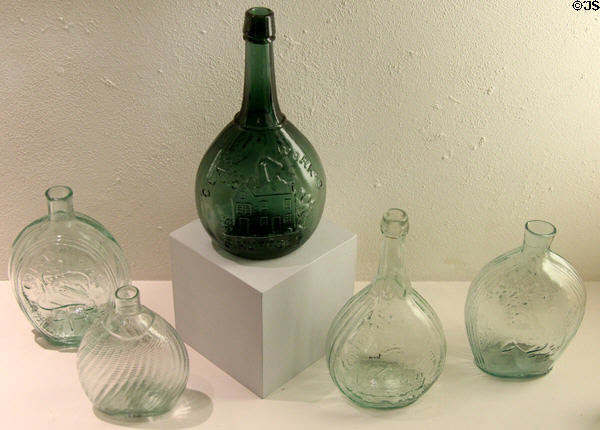Greenish flasks (1800-60) mostly from NJ at Museum of American Glass. Milville, NJ.