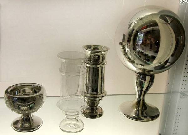 Silvered (aka mercury) glass including salt (1755-70) by New England Glass of Cambridge; vases (one before silvering) & Gazing Ball (1867) by Dithridge & Co. of Pittsburgh at Museum of American Glass. Milville, NJ.