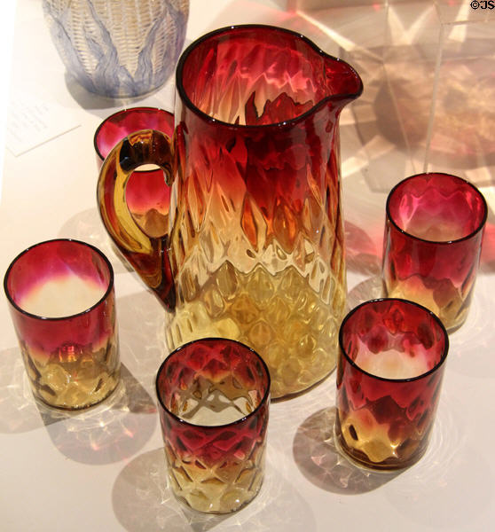 Amberina glass pitcher & tumblers (c1883) by New England Glass Co. of Cambridge, MA at Museum of American Glass. Milville, NJ.
