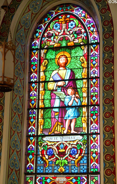 Evangelist St Matthew with angel stained glass window in St Francis Cathedral. Santa Fe, NM.