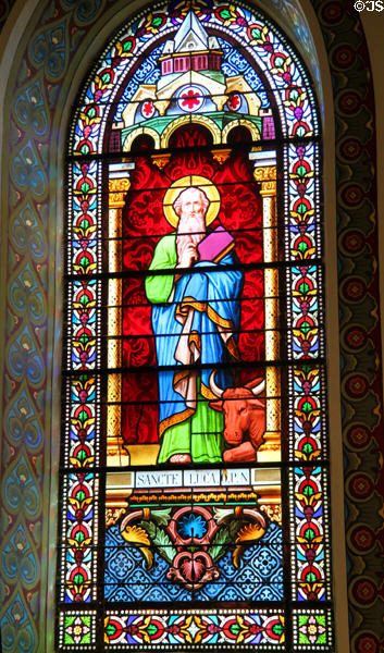 Evangelist St Luke with bull stained glass window in St Francis Cathedral. Santa Fe, NM.
