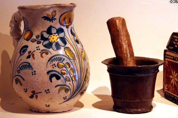 Majolica pitcher from Spain (late 18th or early 19thC) & mortar & pestle from New Mexico (early 19thC) in Delgado home display at Museum of Spanish Colonial Art. Santa Fe, NM.