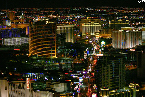 The Strip at night with Wynn, Caesar & Treasure Island Hotel from top of Stratosphere Tower. Las Vegas, NV.