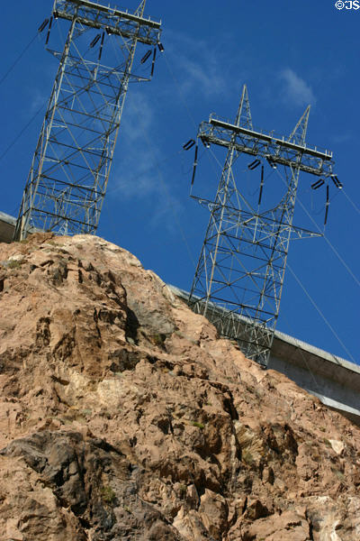 Transmission towers atop rocks of Black Canyon beside Hoover Dam. Las Vegas, NV.
