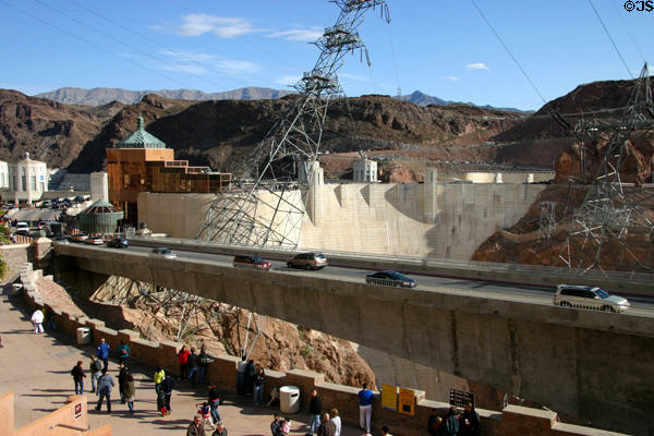 Bridge approaching Hoover Dam past copper colored visitor center. Las Vegas, NV.