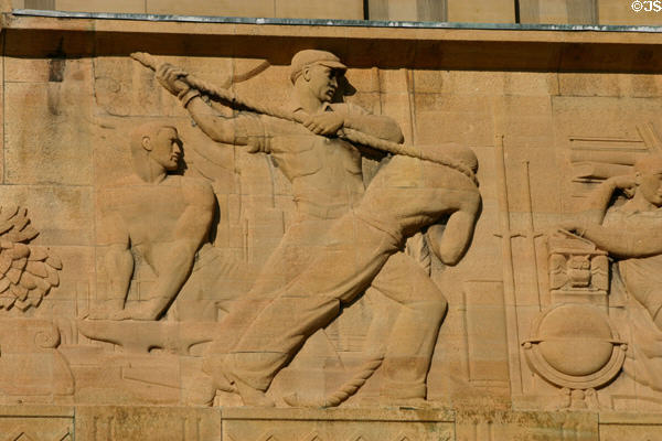 Section of relief on facade of City Hall showing workers hauling a rope. Buffalo, NY.