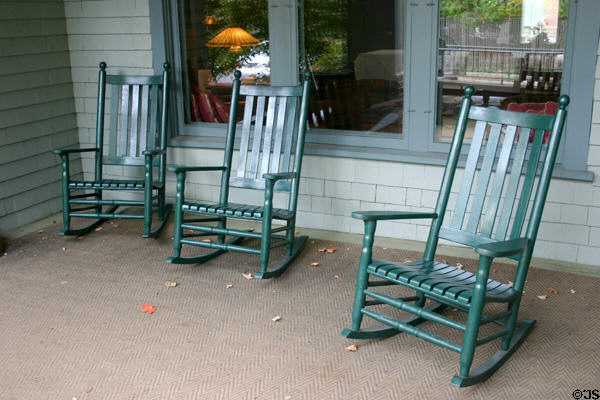 Rocking chairs on veranda of Roycroft Inn reflect era of Elbert Hubbard who died on sinking of S.S. Lusitania. East Aurora, NY.
