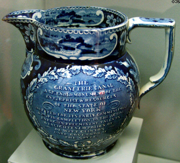 Blue transferware pitcher from Staffordshire, England showing Erie Canal scenes & eulogy to DeWitt Clinton in Buffalo History Museum (BECHS). Buffalo, NY.