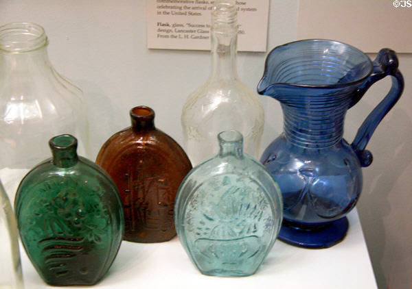 Lancaster Glass Works flasks (c1850) & Lilly-pad blue glass pitcher at Buffalo History Museum (BECHS). Buffalo, NY.