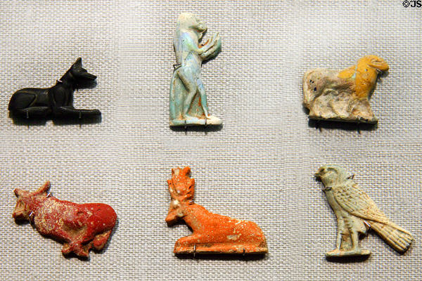 Egyptian glass amulets (c7thC BCE on) for luck in afterlife include jackal, baboon, ram, cows, falcon at Corning Museum of Glass. Corning, NY.