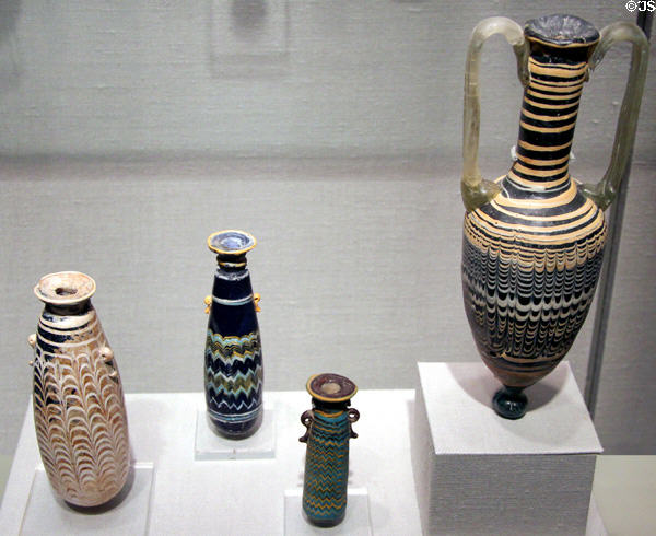 Eastern Mediterranean glass perfume bottles (6th-5thC BCE) & jar (possible from Cyprus) (2nd-1stC BCE) at Corning Museum of Glass. Corning, NY.