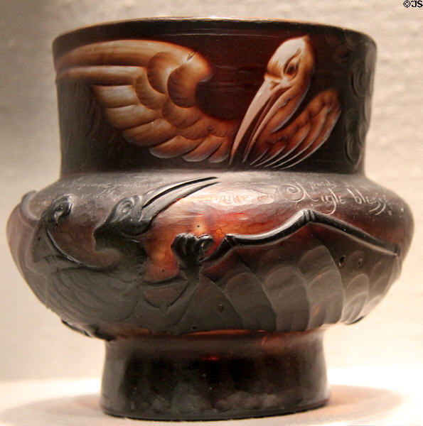 French Art Nouveau glass "Eternal Debate" vase (1890-1900) shows battle between pelican & pterodactyl by Émile Gallé at Corning Museum of Glass. Corning, NY.