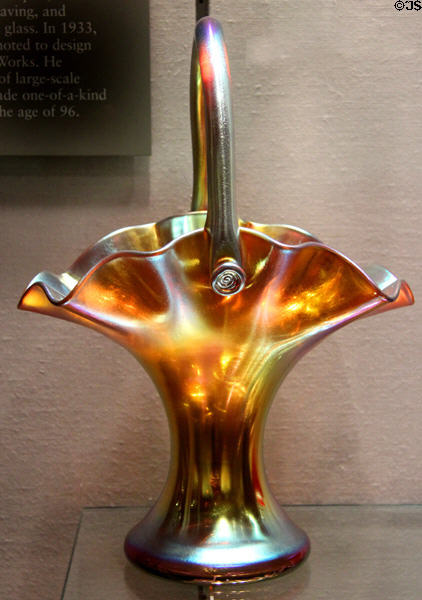 Gold Aurene glass basket with handle (1908-13) by Frederick Carder for Steuben Glass at Corning Museum of Glass. Corning, NY.
