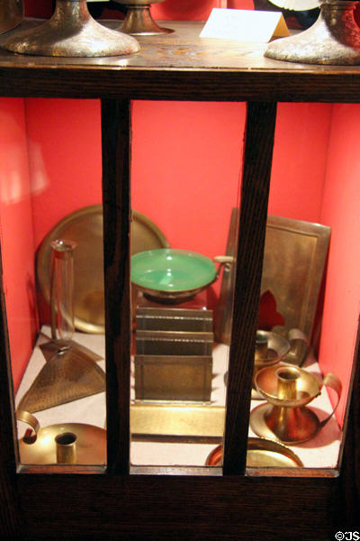 Copper plates & candlesticks from Roycroft Copper Shop at Elbert Hubbard Roycroft Museum. East Aurora, NY.