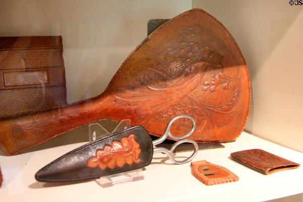 Roycroft leather work mirror & scissors holder at Elbert Hubbard Roycroft Museum. East Aurora, NY.
