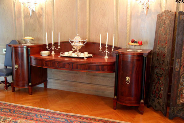 Antique one piece polished hardwood sideboard serving table with end cabinets at Eastman House. Rochester, NY.