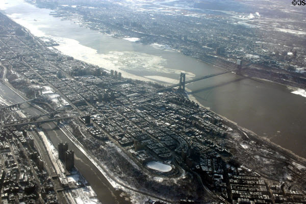 George Washington Bridge & northern end of Manhattan from air with East River crossed by 181st St., Cross Bronx Expressway & High Bridges. New York, NY.